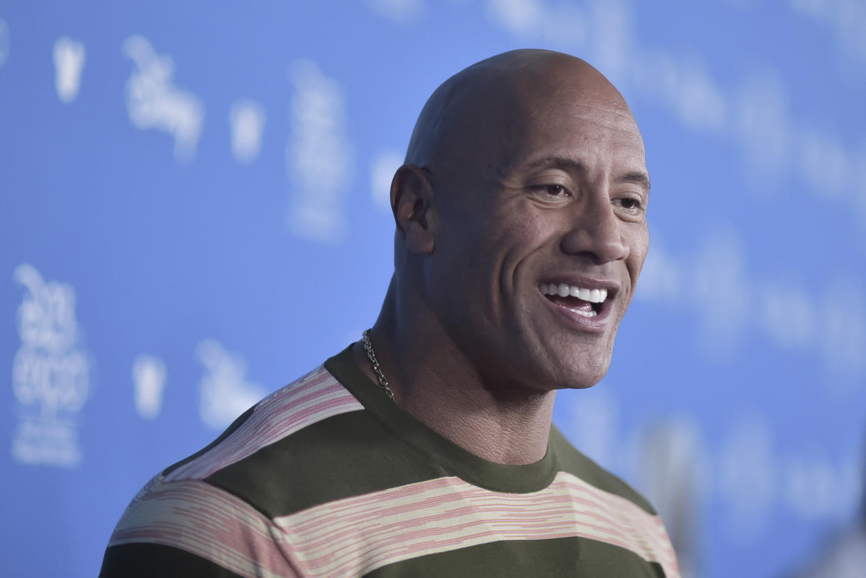 Dwayne Johnson attends the Go Behind the Scenes with the Walt Disney Studios press line at the 2019 D23 Expo on Saturday, Aug. 24, 2019, in Anaheim, Calif. (Photo by Richard Shotwell/Invision/AP)