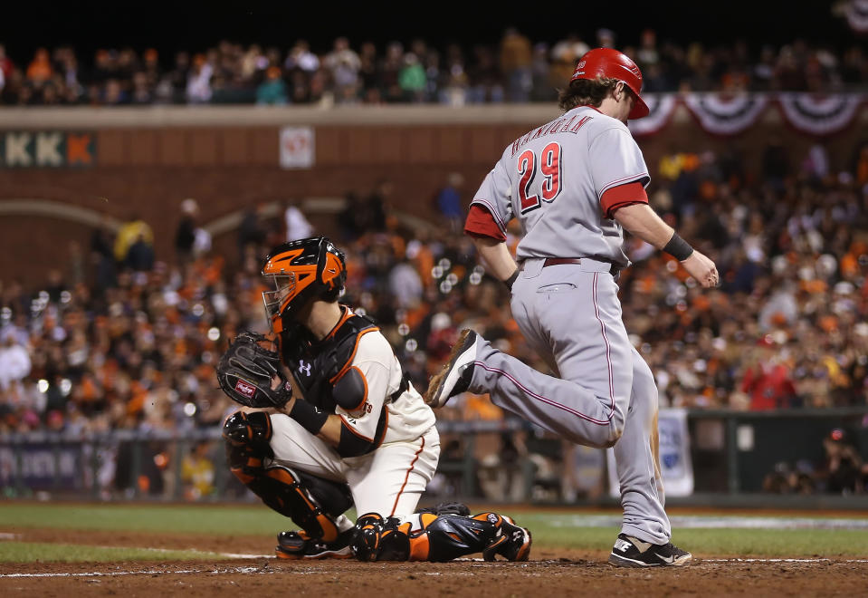 Ryan Hanigan #29 of the Cincinnati Reds scores a run past catcher Buster Posey #28 of the San Francisco Giants in the eighth inning during Game Two of the National League Division Series at AT&T Park on October 7, 2012 in San Francisco, California. (Photo by Jeff Gross/Getty Images)