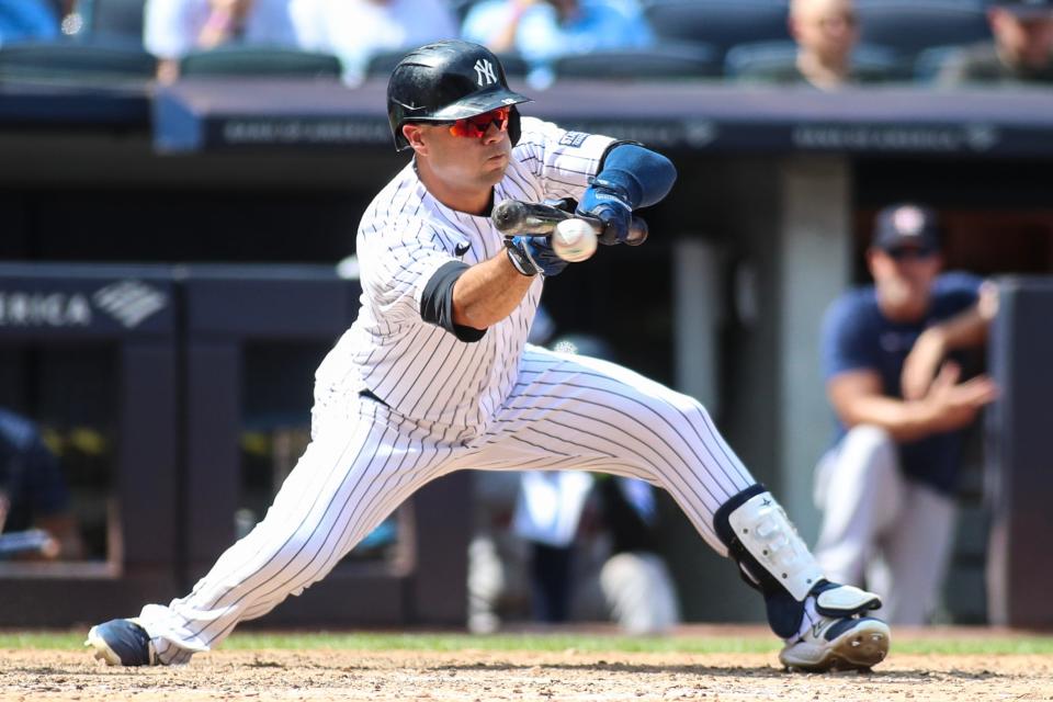 Aug 5, 2023; Bronx, New York, USA; New York Yankees left fielder Isiah Kiner-Falefa (12) attempts a sacrifice bunt in the eighth inning against the Houston Astros at Yankee Stadium.