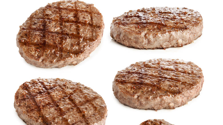 Grilled hamburger patties with char marks