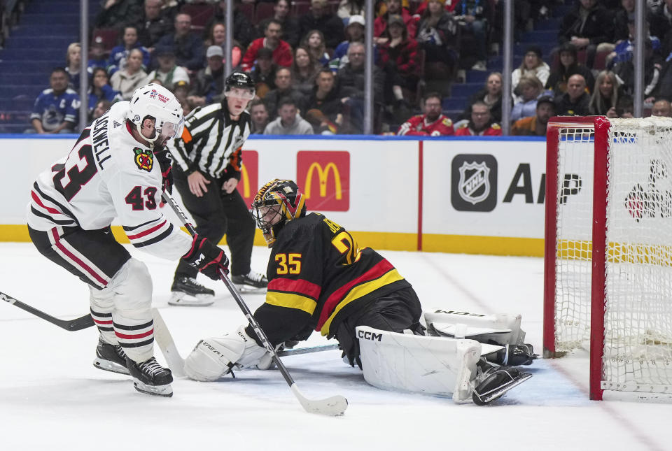 Chicago Blackhawks' Colin Blackwell (43) puts a shot wide of the net on a breakaway against Vancouver Canucks goalie Thatcher Demko (35) during the third period of an NHL hockey game in Vancouver, British Columbia, on Monday, Jan. 22, 2024. (Darryl Dyck/The Canadian Press via AP)