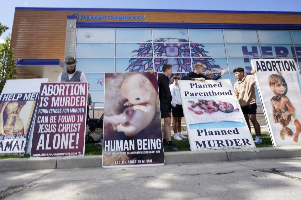 Protesters are seen outside Planned Parenthood, Monday, Sept. 18, 2023, in Milwaukee. (AP Photo/Morry Gash)