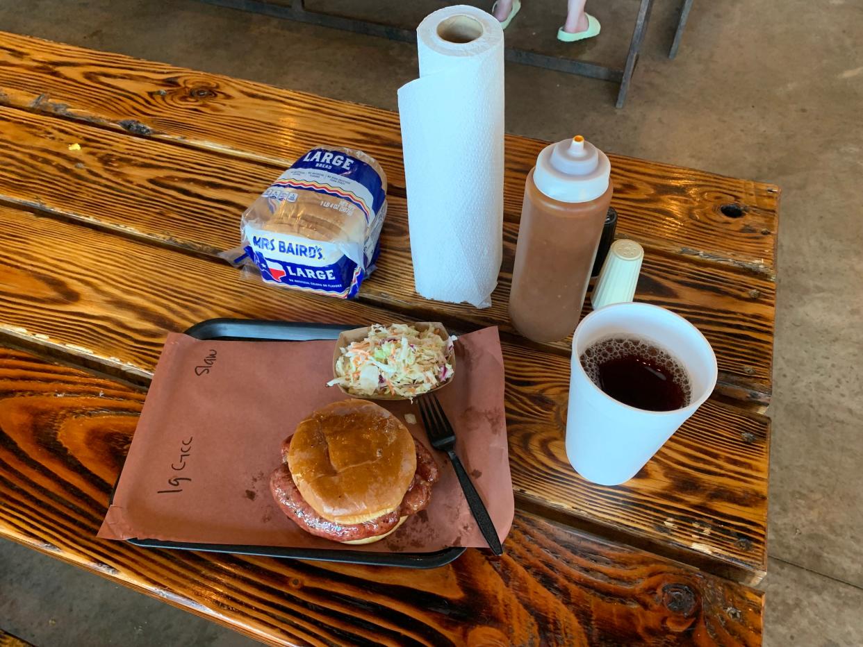 Heaven on a tray at Evie Mae's BBQ in Wolfforth outside Lubbock, Texas. The meal included a large smoked German sausage sandwich, tangy slaw and a barbecue sauce with a bite. Yes, they still serve Mrs. Baird's Bread in the bag.