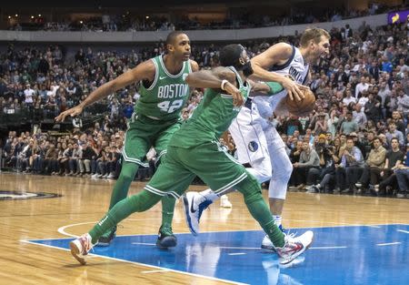 Nov 20, 2017; Dallas, TX, USA; Boston Celtics guard Kyrie Irving (11) knocks the ball away from Dallas Mavericks forward Dirk Nowitzki (41) during the second half at the American Airlines Center. The Celtics defeat the Mavericks 110-102. Jerome Miron-USA TODAY Sports