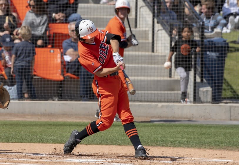 Huntington Beach's Jake Vogel hits a solo home run in the first inning againsgt Vista Murrieta during a first round CIF Southern Section Division 1 playoff game on Friday, May 18.