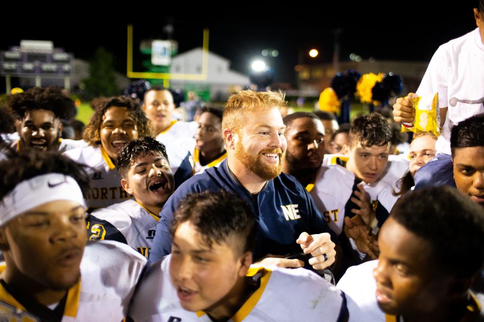of Northeast head coach Chad Watson smiles with his team after the game at Clarksville High Friday, Sept. 28, 2018, in Clarksville, Tenn.