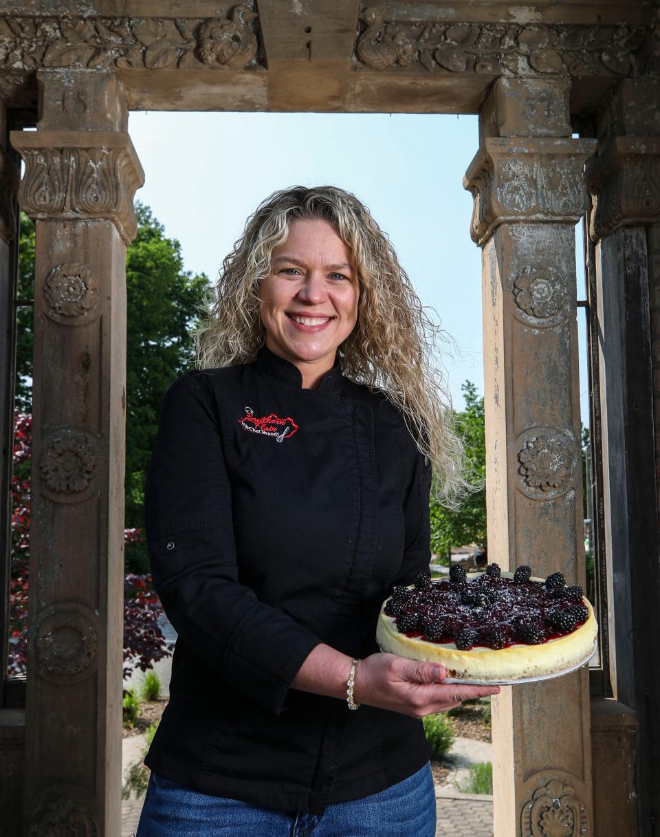 Brandi Alexander, master chef, holds a Blackberry Bourbon Cheesecake. She's opening Southern Flair in Louisville  May 18, 2023.