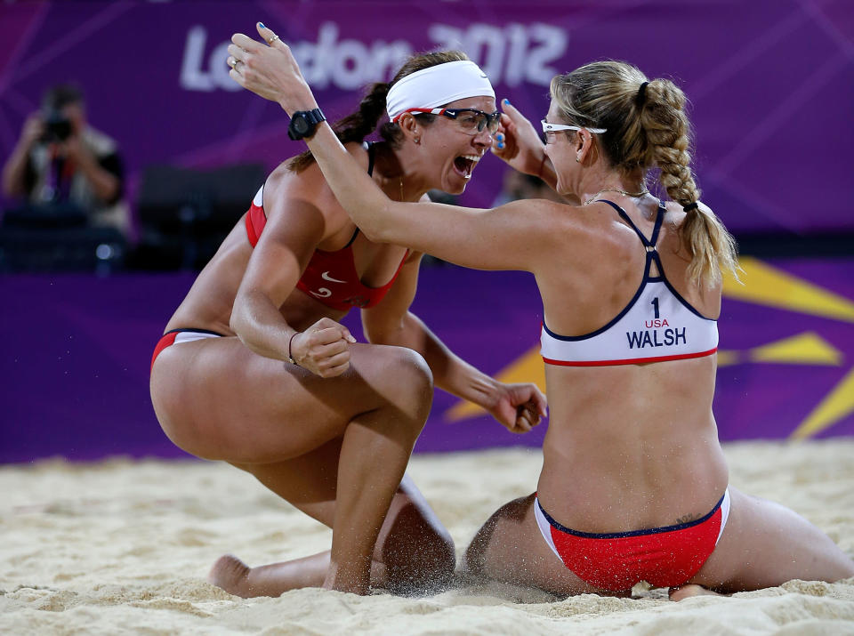 Kerri Walsh Jennings (R) and Misty May-Treanor of the United States celebrate winning the Gold medal in the Women's Beach Volleyball Gold medal match at the London 2012 Olympic Games on August 8, 2012. (Photo by Jamie Squire/Getty Images)<br><br> <b>Related story:</b> <a href="http://yhoo.it/QHXuu4" rel="nofollow noopener" target="_blank" data-ylk="slk:Misty May-Treanor, Kerri Walsh Jennings win third straight Olympic beach volleyball gold;elm:context_link;itc:0;sec:content-canvas" class="link ">Misty May-Treanor, Kerri Walsh Jennings win third straight Olympic beach volleyball gold</a>