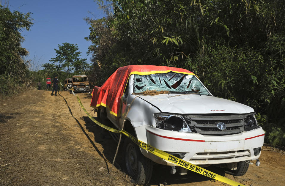 A vandalised truck, where the dead bodies of six civilians had been piled up by Indian army soldiers, stands marked by crime scene tape near Oting, in the northeastern Indian state of Nagaland, Wednesday, Dec. 15, 2021. High up in the hills along India's border with Myanmar, Oting village is in mourning after more than a dozen people were killed by soldiers. The incident earlier this month is the latest violence to shake the state of Nagaland and has left Oting village reeling in shock and grief for their lost ones. (AP Photo/Yirmiyan Arthur)