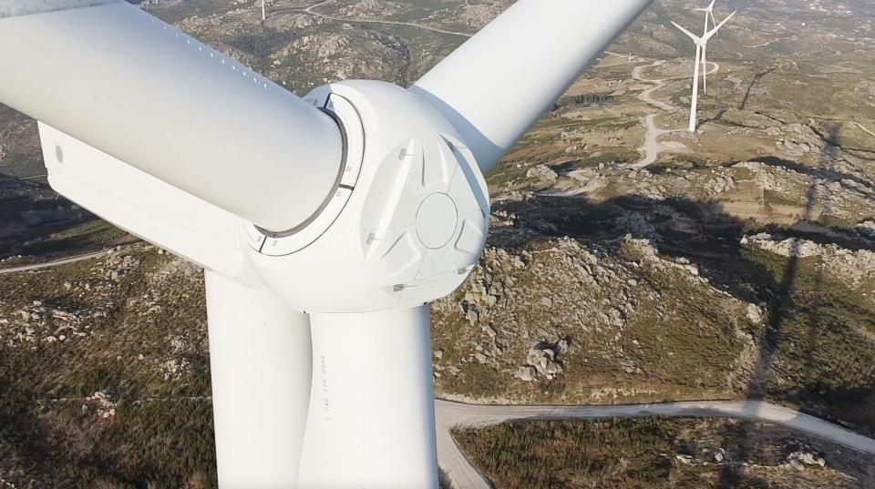 Close up shot of a wind turbine in the mountains.