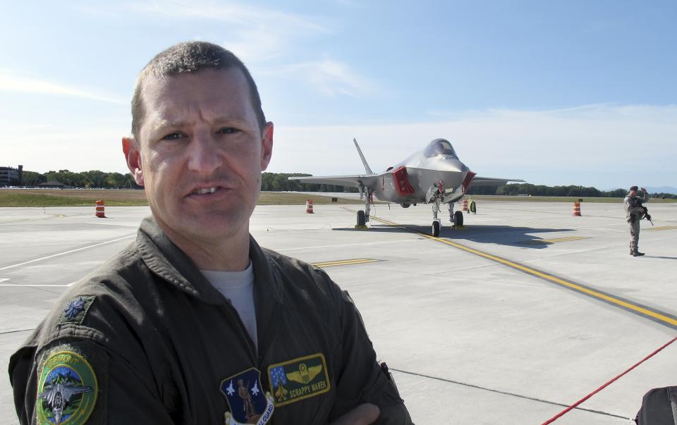 Vermont Air National Guard pilot, Lt. Col. Tony "Scrappy" Marek speaks to the media after piloting one of the first two F-35 fighter jets to the Vermont Air National Guard base on Thursday, Sept. 19, 2019, in South Burlington, Vt. The Vermont Air National Guard is the first guard unit to receive the next-generation fighter. (AP Photo/Wilson Ring)