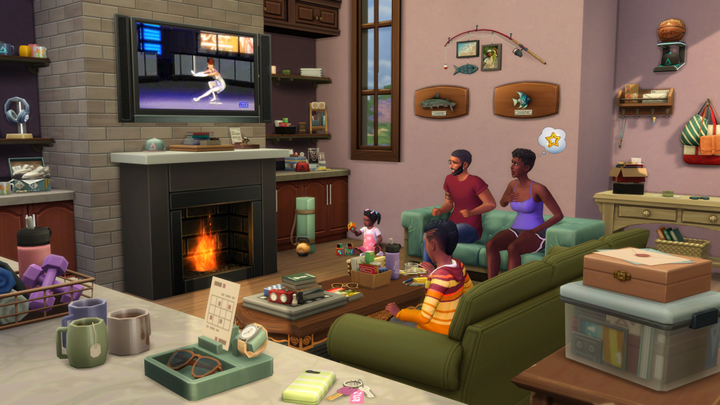 Best Free Steam Games - The Sims 4 - a family of Sims sat around a fire, watching TV.