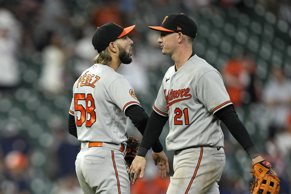 Baltimore Orioles' Austin Hays (21) and Cionel Perez (58) celebrate after a baseball game against the Houston Astros Tuesday, Sept. 19, 2023, in Houston. The Orioles won 9-5. (AP Photo/David J. Phillip)