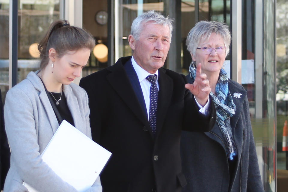 FILE - In this Aug. 22, 2019, file photo, lawyer Bernard Collaery, center, leaves the Australian Capital Territory Supreme Court in Canberra, Australia. A former Australian spy was released from court on Friday, June 18, 2021, with a three-month suspended prison sentence over his attempt to help East Timor prove that Australia spied on the fledgling nation during multi-billion dollar oil and gas negotiations. The former spy publicly known as Witness K and his lawyer Collaery had been charged in 2018 with conspiring to reveal secret information to the East Timorese government. (AP Photo/Rod McGuirk, File)