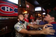 Montreal Canadiens hockey fans react as they watch the second away game of the Stanley Cup Finals