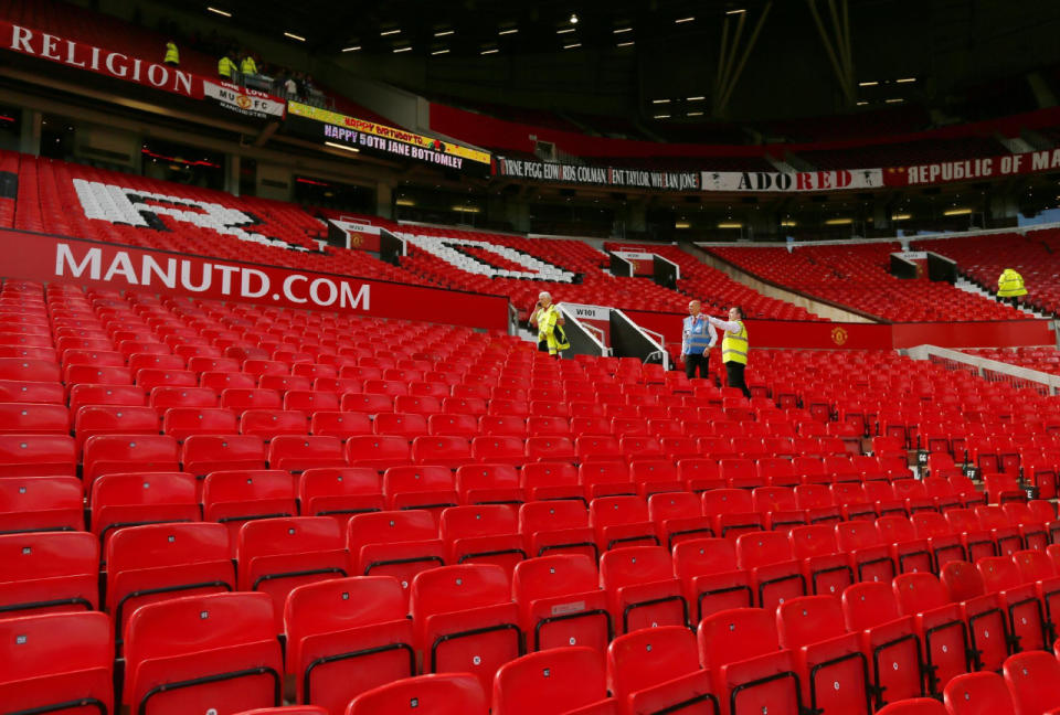 Officials inspect the stands after fans are evacuated from Old Trafford stadium before the Barclays Premier League match between Manchester United and AFC Bournemouth in Manchester, England, on May 15, 2016. (Jason Cairnduff/Livepic/Action Images via Reuters)