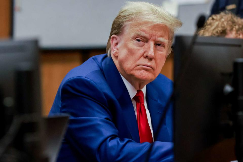 <p>Justin Lane/EPA/Bloomberg via Getty</p> Donald Trump attends a March 25 hearing at Manhattan Criminal Court, where he unsuccessfully sought to have his felony charges dismissed