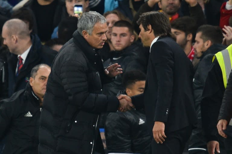 Manchester United manager Jose Mourinho (left) shakes hands with Chelsea boss Antonio Conte at Stamford Bridge on October 23, 2016