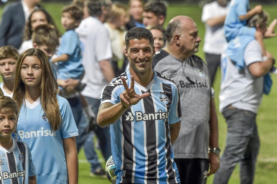 Uruguayan player Luis Suarez smiles during his official presentation as Gremio´s new player during an event at the Gremio Arena stadium, in Porto Alegre, Brazil, Wednesday, Jan. 4, 2023. (AP Photo/Wesley Santos)