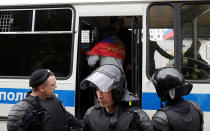 <p>Riot police detain a man covered with Russian national flag during an anti-corruption protest organised by opposition leader Alexei Navalny, on Tverskaya Street in central Moscow, Russia, June 12, 2017. (Maxim Shemetov/Reuters) </p>