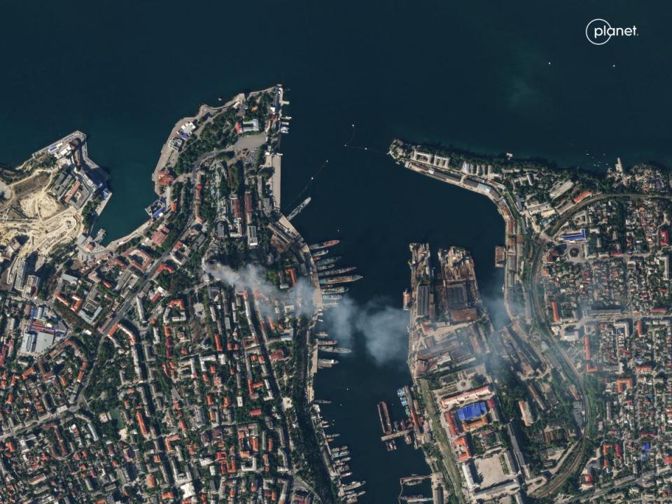 A satellite image shows smoke billowing from a Russian Black Sea Navy HQ after a missile strike on Friday (via REUTERS)