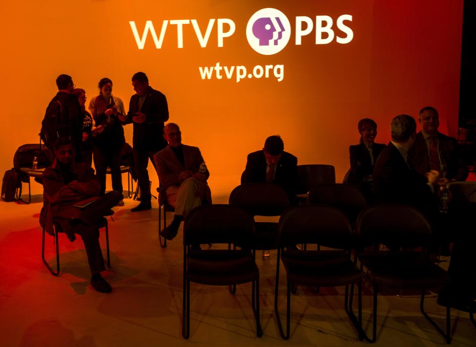 Some of the more than a dozen participants scheduled for inclusion in a live town hall meeting focused on the coronavirus wait Sunday, March 15, 2020 for their entrance into the discussion at the WTVP public television station in Peoria.