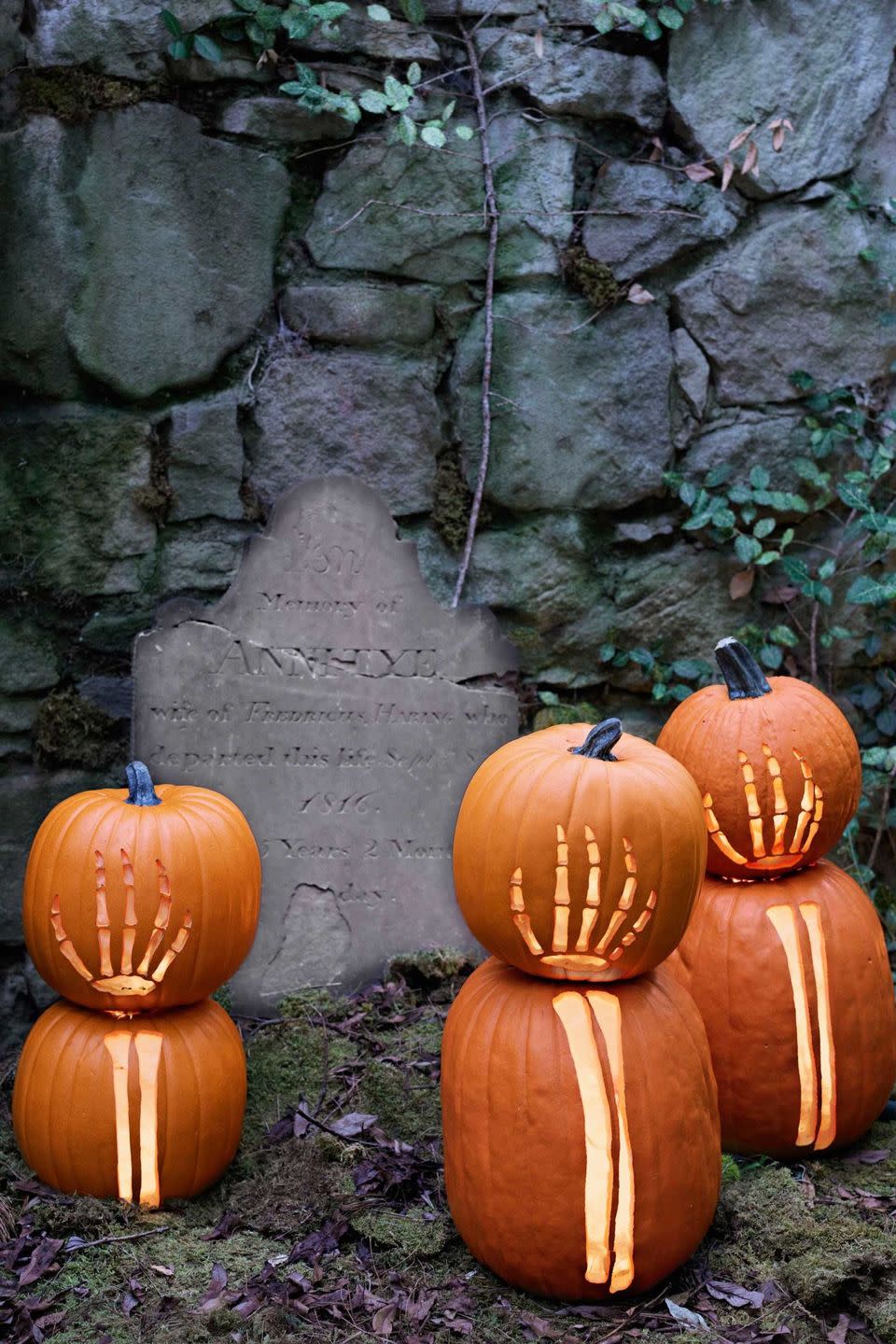 <p>The walking dead are rising up — in your lawn, that is. Carve life-size bony limbs into stacked pumpkins to really make a statement (especially if you place them around a faux gravestone). <br></p>