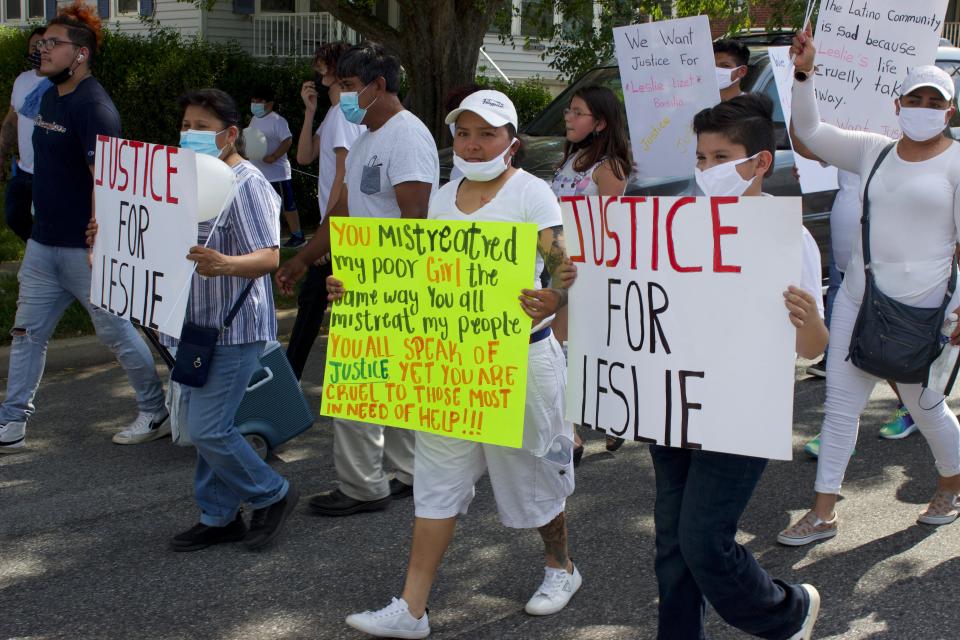 Residents march toward the Metro by T-Mobile store in Elsmere to demand justice for Leslie Lizet Basilio on Sunday, May 23, 2021.