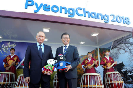 FILE PHOTO: Russian President Vladimir Putin and his South Korean counterpart Moon Jae-in visit the Far East Street exhibition at Russky Island in Vladivostok, Russia September 6, 2017. Sputnik/Mikhail Klimentyev/Kremlin via REUTERS