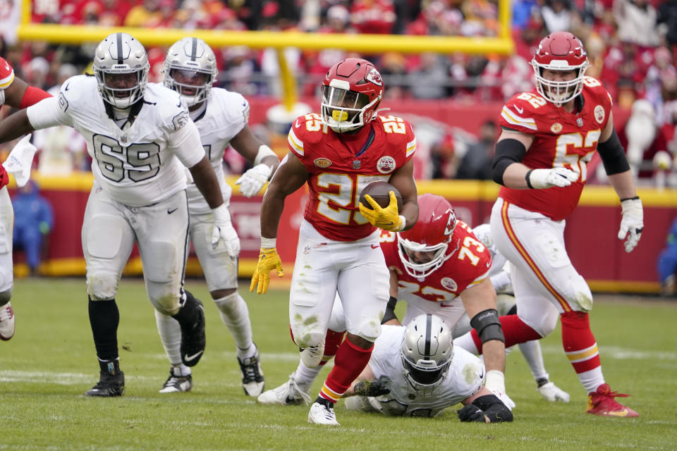 Kansas City Chiefs running back Clyde Edwards-Helaire (25) runs for a first down during the second half of an NFL football game against the Las Vegas Raiders Monday, Dec. 25, 2023, in Kansas City, Mo. (AP Photo/Ed Zurga)