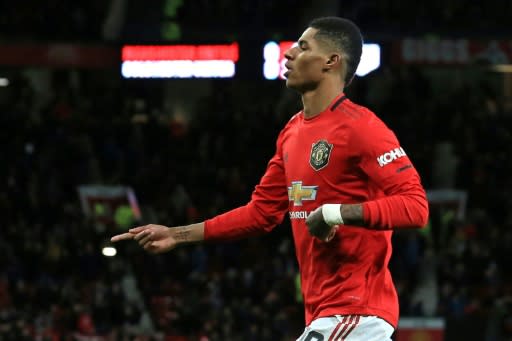 Main man: Marcus Rashford scored his 14th goal of the season for Manchester United against Colchester