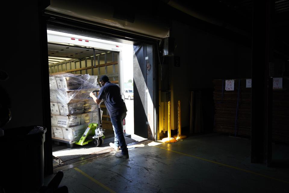 A load of absentee ballots is loaded onto a truck for mailing at the Wake County Board of Elections in North Carolina Thursday. (Photo: ASSOCIATED PRESS)