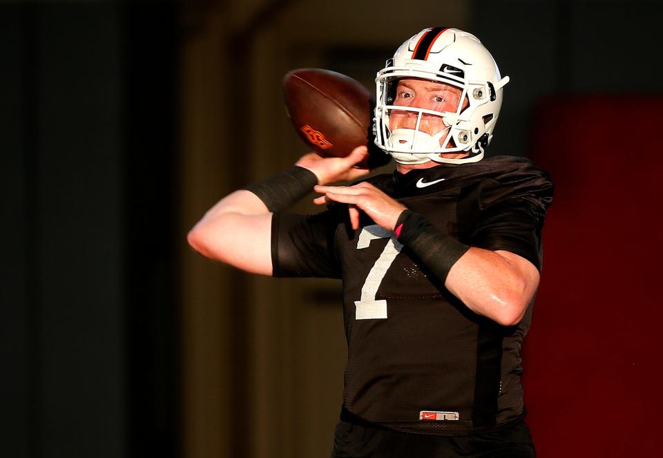 Oklahoma State quarterback Alan Bowman throws a pass during practice in Stillwater on Aug. 2.