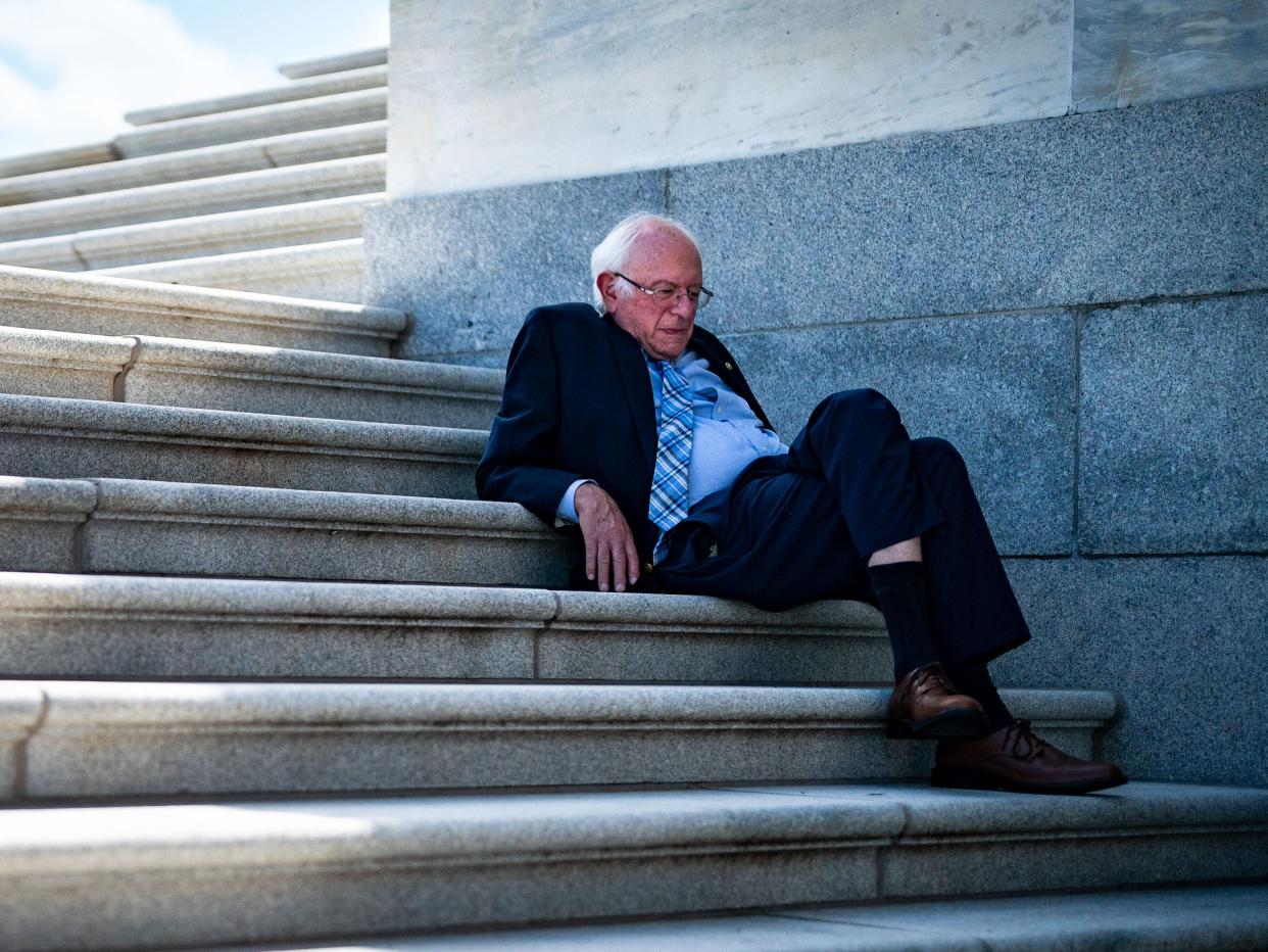 Sen. Bernie Sanders (I-VT), whose amendment was defeated 1-99, sits in the shade on the steps of the Senate as the Senate proceeds through a series of amendment votes, also called "vote-a-rama, on the Inflation Reduct Act at the U.S. Capitol on Sunday, Aug. 7, 2022 in Washington, DC.