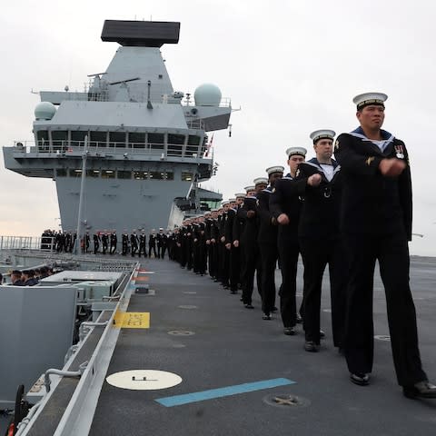 crew on the deck of HMS Queen Elizabeth, the UK's newest aircraft carrier, as the ship arrives in Portsmouth - Credit: Ray Jonesn/Royal Navy/PA