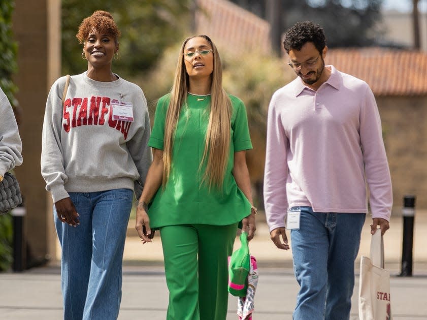 A group of friends walking at Stanford's campus in the show "Insecure."