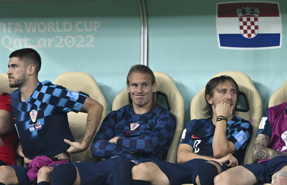 LUSAIL CITY, QATAR - DECEMBER 13: Luka Modric (R) of Croatia gets upset at the end of FIFA World Cup Qatar 2022 Semi-Final match between Argentina and Croatia at Lusail Stadium on December 13, 2022, in Lusail City, Qatar. (Photo by Ercin Erturk/Anadolu Agency via Getty Images)
