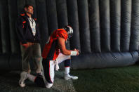 Quarterback Tim Tebow of the Denver Broncos prepares to take the field to face the Detroit Lions at Invesco Field at Mile High on October 30, 2011 in Denver, Colorado. With much fanfare surrounding his starts with the Broncos, Tebow struggled mightily and had two turnovers returned for touchdowns. (Photo by Doug Pensinger/Getty Images)