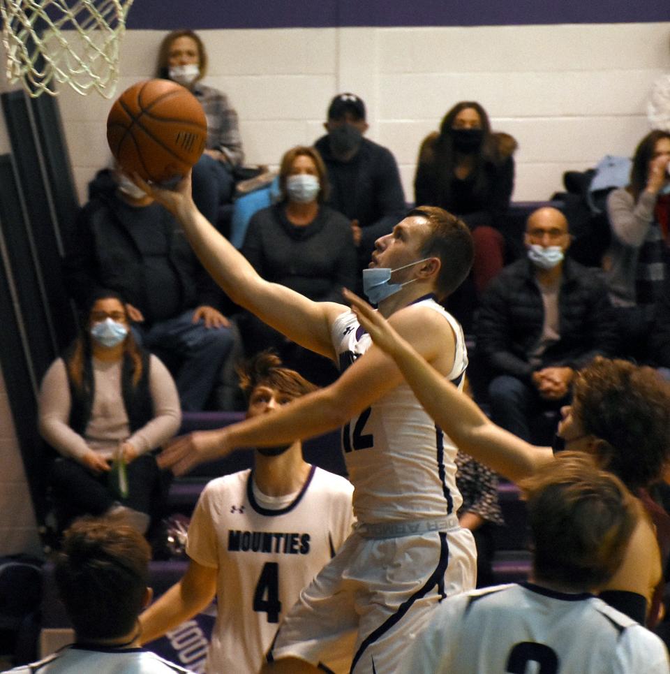 Little Falls Mountie Rikki Smith lays the ball up for a basket during the second quarter of Tuesday's game against Canastota.