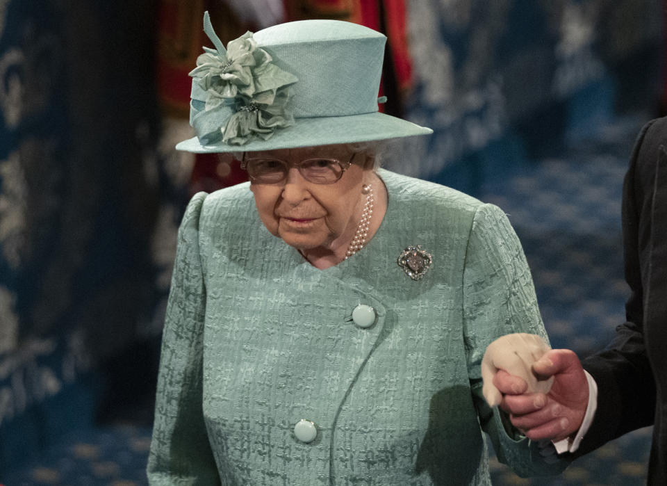 Queen Elizabeth II holds the hand of Prince Charles, Prince of Wales as they attend the State Opening of Parliament at the Houses of Parliament on December 19, 2019 in London, England. In the second Queen's speech in two months, Queen Elizabeth II will unveil the majority Conservative government's legislative programme to Members of Parliament and Peers in The House of Lords.