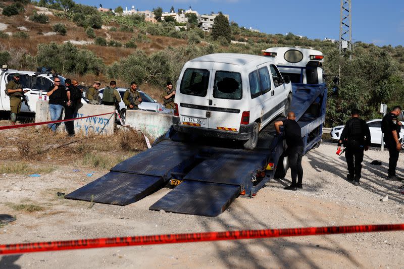 Israeli troops stand guard at the shooting attack scene near Nablus