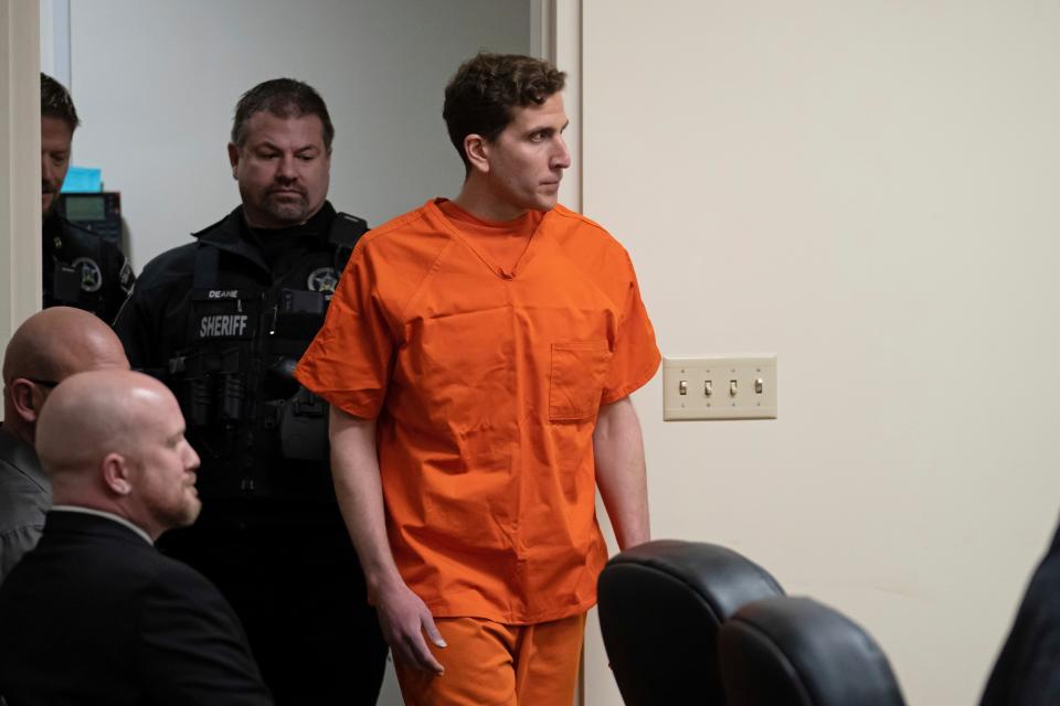 Bryan Kohberger, right, who is accused of killing four University of Idaho students in November 2022, is escorted into a courtroom for a hearing in Latah County District Court, Thursday, Jan. 5, 2023, in Moscow, Idaho (AP)