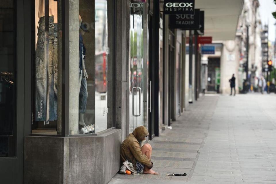 A homeless person is seen on Oxford Street in central London in May this year: AFP via Getty Images