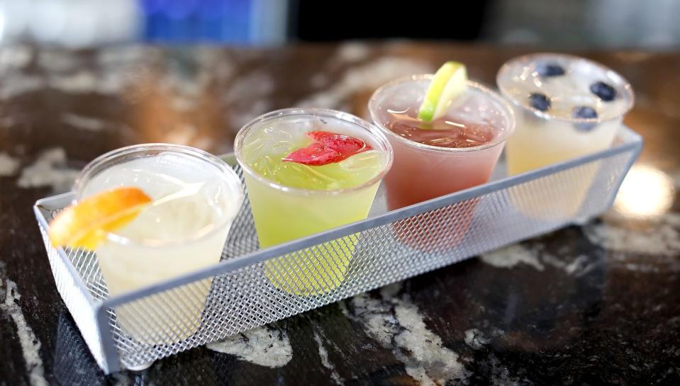 A flight of margaritas includes peach, melon, raspberry and mango flavors at The Pour Yard in Quincy.