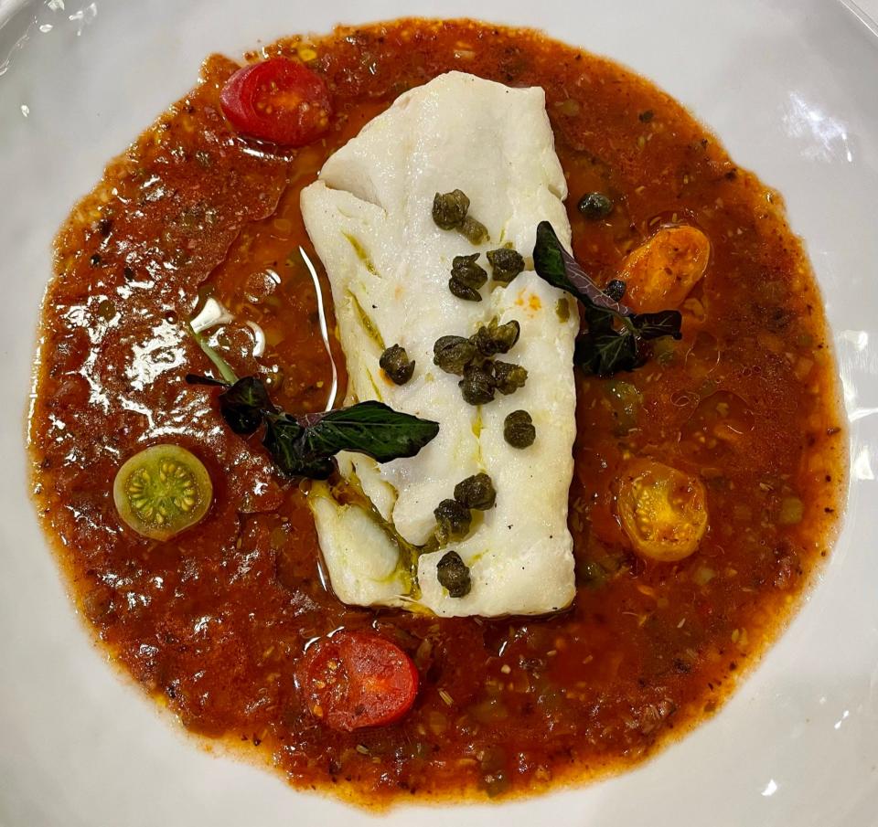 Baccalà, a pacific cod loin with seafood broth, five onion puttanesca soffritto, oven roasted black olive caviar and lavender vinegar, served at Lupa Ristorante in Berkeley Heights.