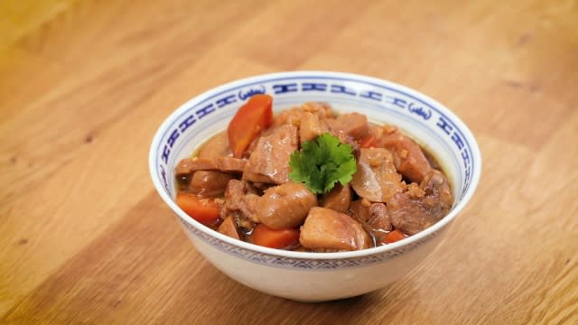 Braised chicken and button mushrooms in a Chinese porcelain bowl