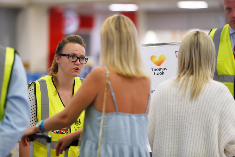 British government officials assist Thomas Cook passengers after the collapse of the travel firm, at Malta International Airport, Malta September 23, 2019. REUTERS/Darrin Zammit Lupi