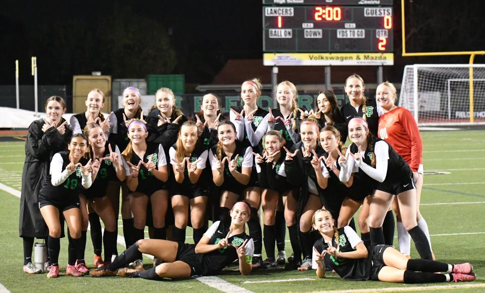 The Thousand Oaks High girls soccer team poses for a photo after beating Oaks Christian 1-0 on Wednesday, Jan. 24, 2024, to halt the Lions' 21-match unbeaten streak in Marmonte League play.