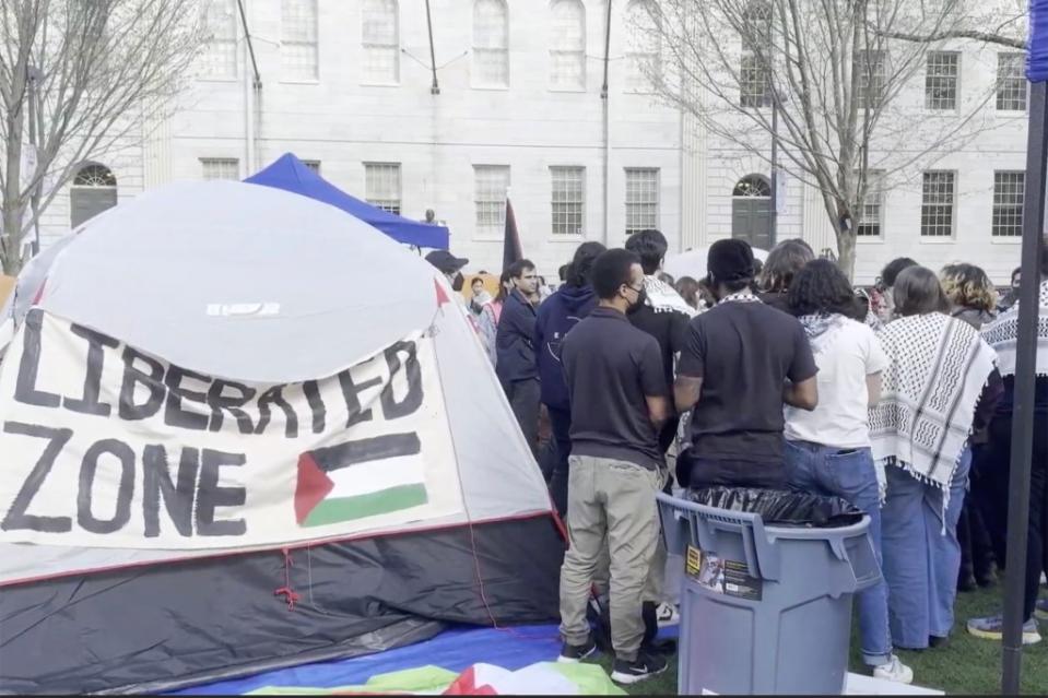 Approximately 200 anti-Israel students took over the lawn in front of the John Harvard statue. Loudlabs