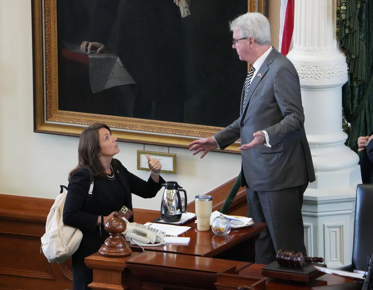 Sen. Angela Paxton, R - McKinney, talks to Lt. Gov. Dan Patrick in the Senate Chamber at the Capitol before the Senate was expected consider the rules for the impeachment of her husband Attorney General Ken Paxton on Tuesday June 20, 2023. 